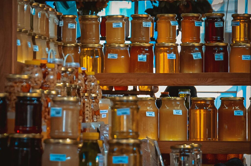 Honey in Jars on Shelves